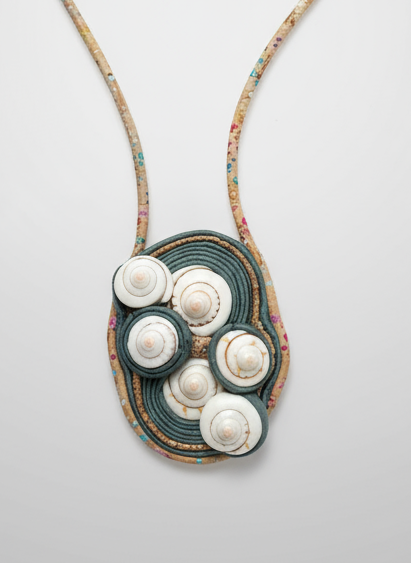 Necklace with a pendant featuring white stones on a gray background