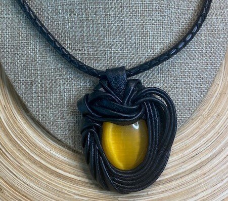 “Yellow Cat Eye” Leather Necklace and pendant.