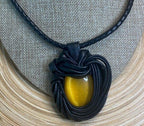 “Yellow Cat Eye” Leather Necklace and pendant.