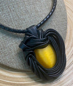 “Yellow Cat Eye” Leather Necklace and pendant.